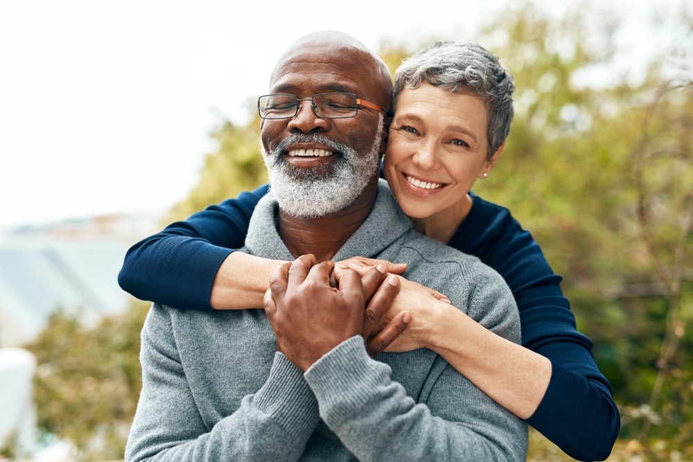 Utah Denture & Implant Center - Happy Couple With Snap-In Dentures